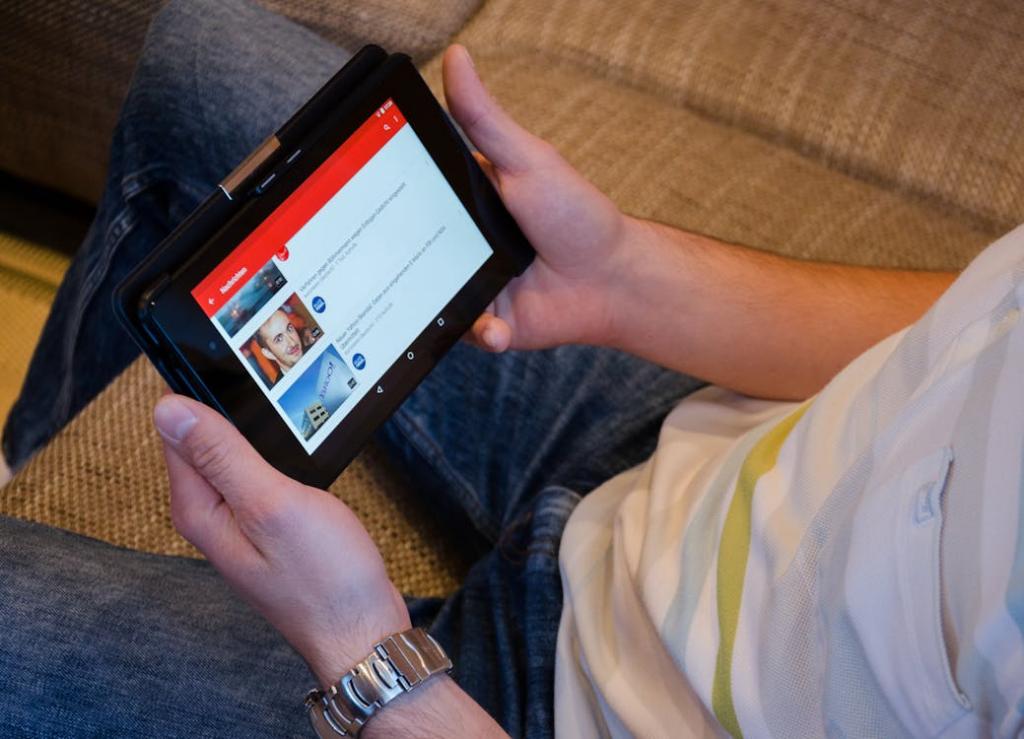 person streaming video news replacing traditional tv on a tablet at home