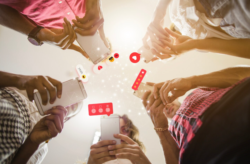 people sharing content on smartphones showing why stories go viral on social media